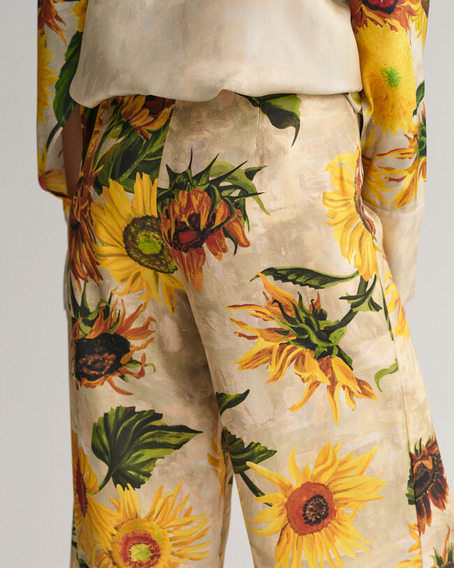Weite Seidenhose mit Sonnenblumen-Print