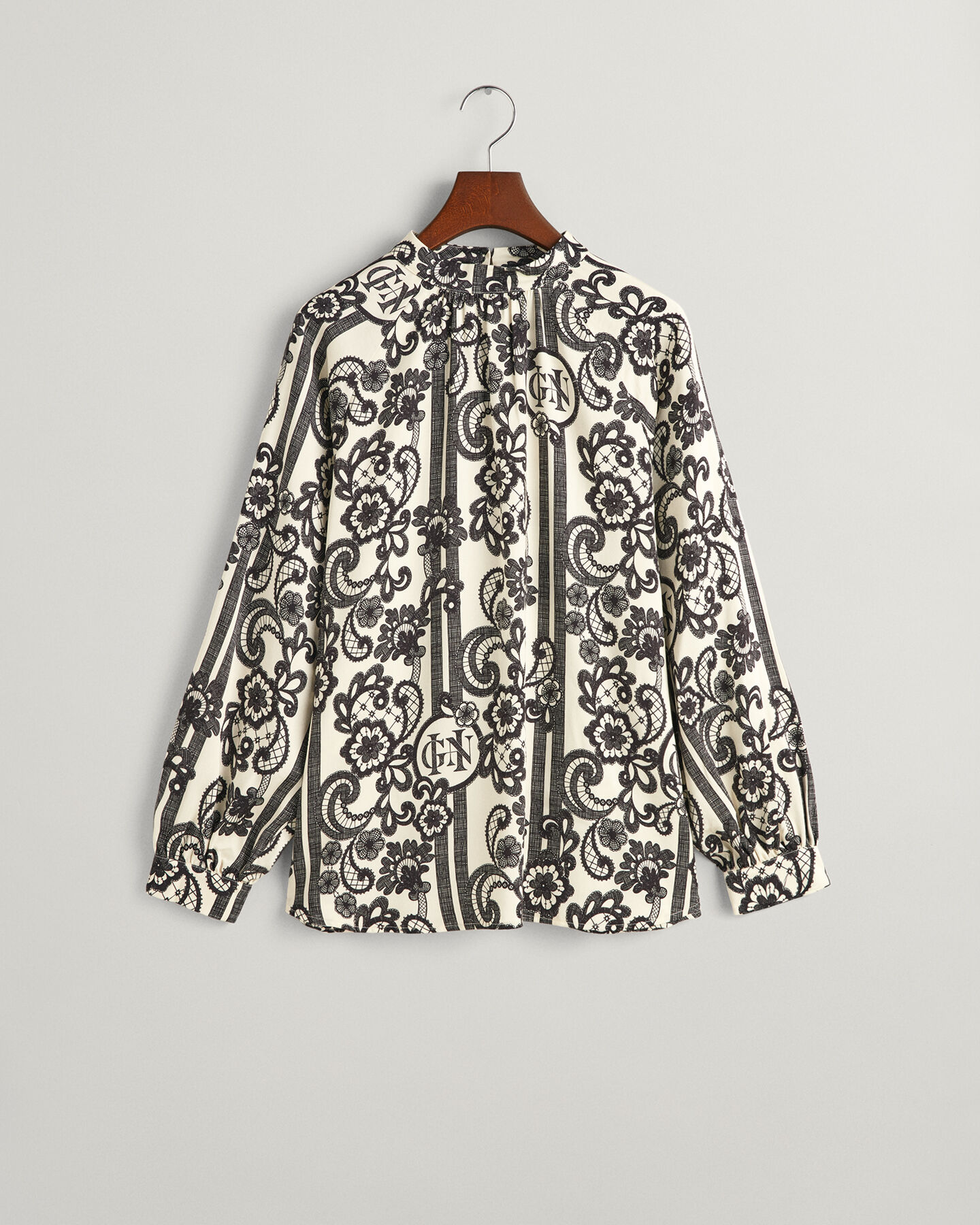 Rollkragenbluse mit Spitzen-Print