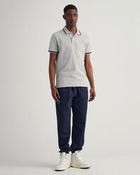 Piqu&eacute; Poloshirt mit Fischgr&auml;tmuster und Kontraststreifen